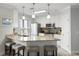 Bright kitchen with island, seating, granite counters, stainless appliances, and pendant lighting at 1140 Ocean Blvd # 201, Isle of Palms, SC 29451