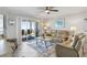 The bright living room leads to a cozy balcony with stunning ocean views and comfortable seating for outdoor enjoyment at 1140 Ocean Blvd # 201, Isle of Palms, SC 29451
