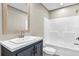 This is a clean bathroom with a white sink, dark vanity, and a shower with a built-in seat at 119 Silver King Ave, Cross, SC 29436