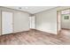 Spacious bedroom with wood-look floors, ample natural light from windows, and doors leading to other areas at 119 Silver King Ave, Cross, SC 29436