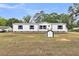 Home with a well-manicured lawn and charming outdoor shed at 119 Silver King Ave, Cross, SC 29436