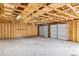 Spacious two car garage with plywood framing and concrete flooring; plenty of room for vehicles or storage at 119 Silver King Ave, Cross, SC 29436