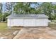 White detached garage with two doors and a concrete driveway at 119 Silver King Ave, Cross, SC 29436