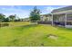 Spacious backyard featuring a well-maintained lawn, and a view of the pond at 121 Keaton Brook Dr, Summerville, SC 29485