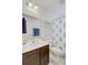 Bright bathroom featuring a white vanity, large mirror and patterned shower curtain at 121 Keaton Brook Dr, Summerville, SC 29485