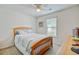 Bright bedroom with a ceiling fan and a cozy bed near a window with wood trim at 121 Keaton Brook Dr, Summerville, SC 29485