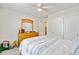 Well-lit bedroom with a ceiling fan and a full-size bed next to a wooden dresser at 121 Keaton Brook Dr, Summerville, SC 29485