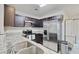 Modern kitchen featuring stainless steel appliances, granite countertops, and dark wood cabinets at 121 Keaton Brook Dr, Summerville, SC 29485