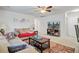 Spacious living room with two sofas, side tables, a large window, a TV and an accent rug at 121 Keaton Brook Dr, Summerville, SC 29485