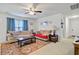 Spacious living room with two sofas, side tables, a large window and an accent rug at 121 Keaton Brook Dr, Summerville, SC 29485