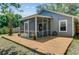 Charming backyard with a screened patio and wooden deck for outdoor living at 1224 Decoy Ct, Mount Pleasant, SC 29464