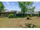 Backyard featuring a storage shed, fire pit, and wooden fence surrounding the property at 1224 Decoy Ct, Mount Pleasant, SC 29464