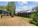 Backyard featuring a wooden fence, complemented by green shrubbery and a view of neighboring homes at 1224 Decoy Ct, Mount Pleasant, SC 29464