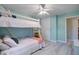 Bedroom featuring a bunk bed, wood-look floors, a ceiling fan, a window, and a sliding door closet at 1224 Decoy Ct, Mount Pleasant, SC 29464