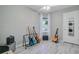 Light filled bedroom features wood-look floors, a ceiling fan, a window, and an in-closet laundry area at 1224 Decoy Ct, Mount Pleasant, SC 29464