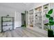 Bright bonus room with built-in bookshelves and decorative plants and storage at 1224 Decoy Ct, Mount Pleasant, SC 29464