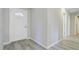 Welcoming entryway with light gray walls, modern flooring and a white front door at 1224 Decoy Ct, Mount Pleasant, SC 29464