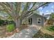 Charming one-story home exterior with a well-maintained lawn and mature trees at 1224 Decoy Ct, Mount Pleasant, SC 29464