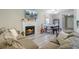 Cozy living room featuring a fireplace, comfortable sectional sofa, and dining area at 1224 Decoy Ct, Mount Pleasant, SC 29464