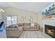 Open-concept living room with fireplace, modern decor, and sliding glass doors at 1224 Decoy Ct, Mount Pleasant, SC 29464