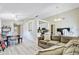 Open-concept living space with wood-look floors, dining area, and adjacent kitchen at 1224 Decoy Ct, Mount Pleasant, SC 29464