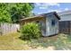 Weathered backyard outbuilding, surrounded by green grass and a wooden fence at 1224 Decoy Ct, Mount Pleasant, SC 29464