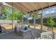Relaxing screened porch with comfortable seating and a view of the backyard at 1224 Decoy Ct, Mount Pleasant, SC 29464