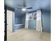 Stylish blue attic room with natural light, wood floors, and an ensuite bathroom at 1228 Penny Cir, Mount Pleasant, SC 29464