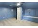 Unique blue attic room with built-in seating, wood floors, and plenty of natural light at 1228 Penny Cir, Mount Pleasant, SC 29464