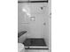 Modern shower features sleek glass door, bench seat, and black tiled floor at 1228 Penny Cir, Mount Pleasant, SC 29464