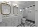 Elegant bathroom with double vanity, stylish mirrors, and glass shower with seat at 1228 Penny Cir, Mount Pleasant, SC 29464