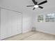 Simple bedroom featuring a ceiling fan, neutral decor, a double closet, and a double window at 1228 Penny Cir, Mount Pleasant, SC 29464