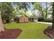 Charming brick home with a well-manicured front yard, mature trees, and a one car garage at 1228 Penny Cir, Mount Pleasant, SC 29464
