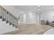Bright living room boasts hardwood floors, modern staircase, and elegant archway at 1228 Penny Cir, Mount Pleasant, SC 29464