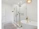 Bathroom featuring a glass enclosed shower with a soaking tub and decorative lighting at 1483 Harborsun Dr, Charleston, SC 29412