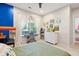bedroom features a large window with an accent wall, desk, and musical keyboard at 1483 Harborsun Dr, Charleston, SC 29412