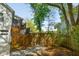 Backyard view of the wooden deck and landscaped pathway in the backyard at 1483 Harborsun Dr, Charleston, SC 29412
