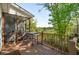 Outdoor deck overlooking a lawn, with a grill, wooden railings, and a screened porch at 1483 Harborsun Dr, Charleston, SC 29412