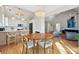 Charming dining area adjacent to modern kitchen with stylish lighting fixtures at 1483 Harborsun Dr, Charleston, SC 29412