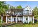 Rear exterior view of a multi-level home with decks and a screened-in porch at 1483 Harborsun Dr, Charleston, SC 29412