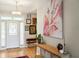 Inviting foyer featuring a chandelier, hardwood floors, and stylish wall decor at 1483 Harborsun Dr, Charleston, SC 29412