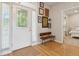 Entryway with hardwood floors, decorative front door with sidelights and a wooden bench at 1483 Harborsun Dr, Charleston, SC 29412
