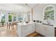 Well-lit kitchen features an island with quartz countertop, white cabinetry, and stainless steel appliances at 1483 Harborsun Dr, Charleston, SC 29412