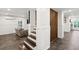 Living room with dark hardwood floors and stairs at 1483 Harborsun Dr, Charleston, SC 29412