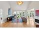 Bright and airy living room with hardwood floors, vaulted ceilings, and a cozy fireplace at 1483 Harborsun Dr, Charleston, SC 29412
