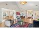 Open concept living room with fireplace flows seamlessly into dining and entry areas at 1483 Harborsun Dr, Charleston, SC 29412