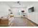 Bright office space featuring wainscoting, a ceiling fan, neutral carpet and a modern work space at 1483 Harborsun Dr, Charleston, SC 29412
