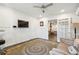 Bright office space featuring wainscoting, a ceiling fan, neutral carpet and a modern work space at 1483 Harborsun Dr, Charleston, SC 29412