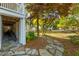 The side yard features a stone pathway, lush landscaping, and convenient access to the street at 1483 Harborsun Dr, Charleston, SC 29412