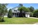 Charming two-story home with brick accents, a covered porch, and a well-manicured lawn at 15 Muirfield Village Ct, Summerville, SC 29483